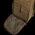The Condor Fuel Hydration Backpack 18L in brown features an open front pocket with an interior mesh zippered compartment for gear organization and an external buckle closure.